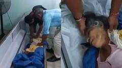 Bella Montoya siendo rescatada del ataúd por sus familiares.