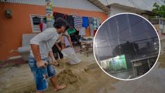 Habitantes del barrio El Pasito, de Soledad, limpian sus viviendas afectadas por las lluvias.