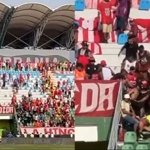 Imágenes de la pelea entre hinchas en la tribuna.