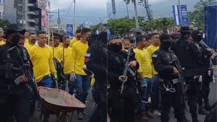 Prisioneros llevados a limpiar las calles mientras son custodiados por la Policía.