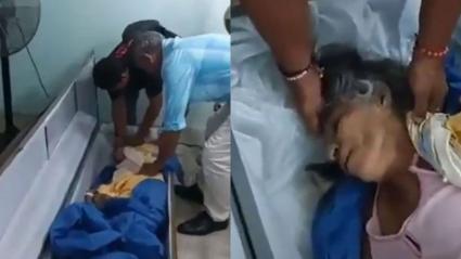 Bella Montoya siendo rescatada del ataúd por sus familiares.